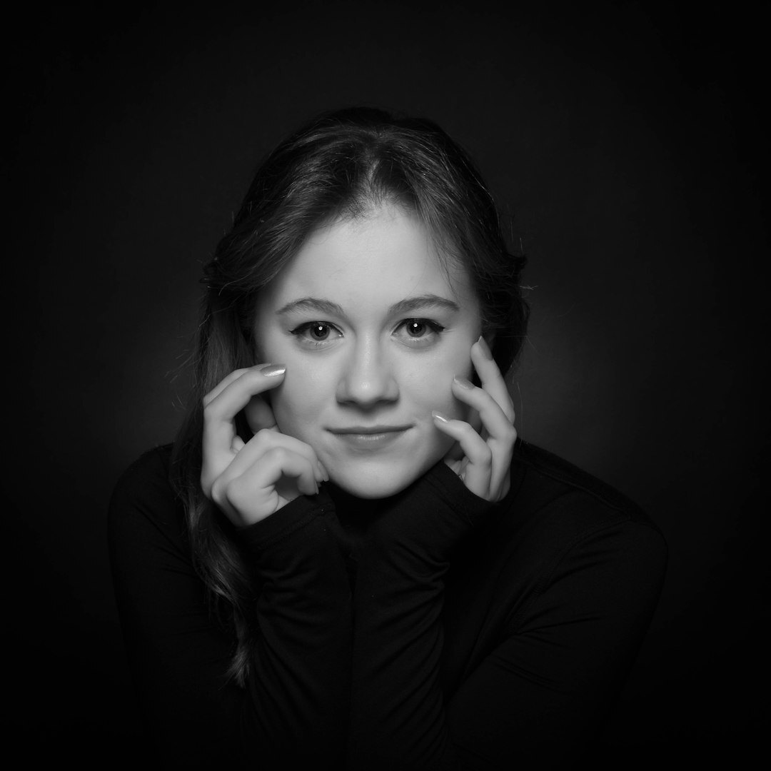 Studio portrait of a senior Swiss-French television presenter in a blazer